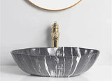 MarmoOval 12L – Eleganter Ovaler Keramik-Aufsatzwaschtisch in Marmoroptik für Einlocharmatur